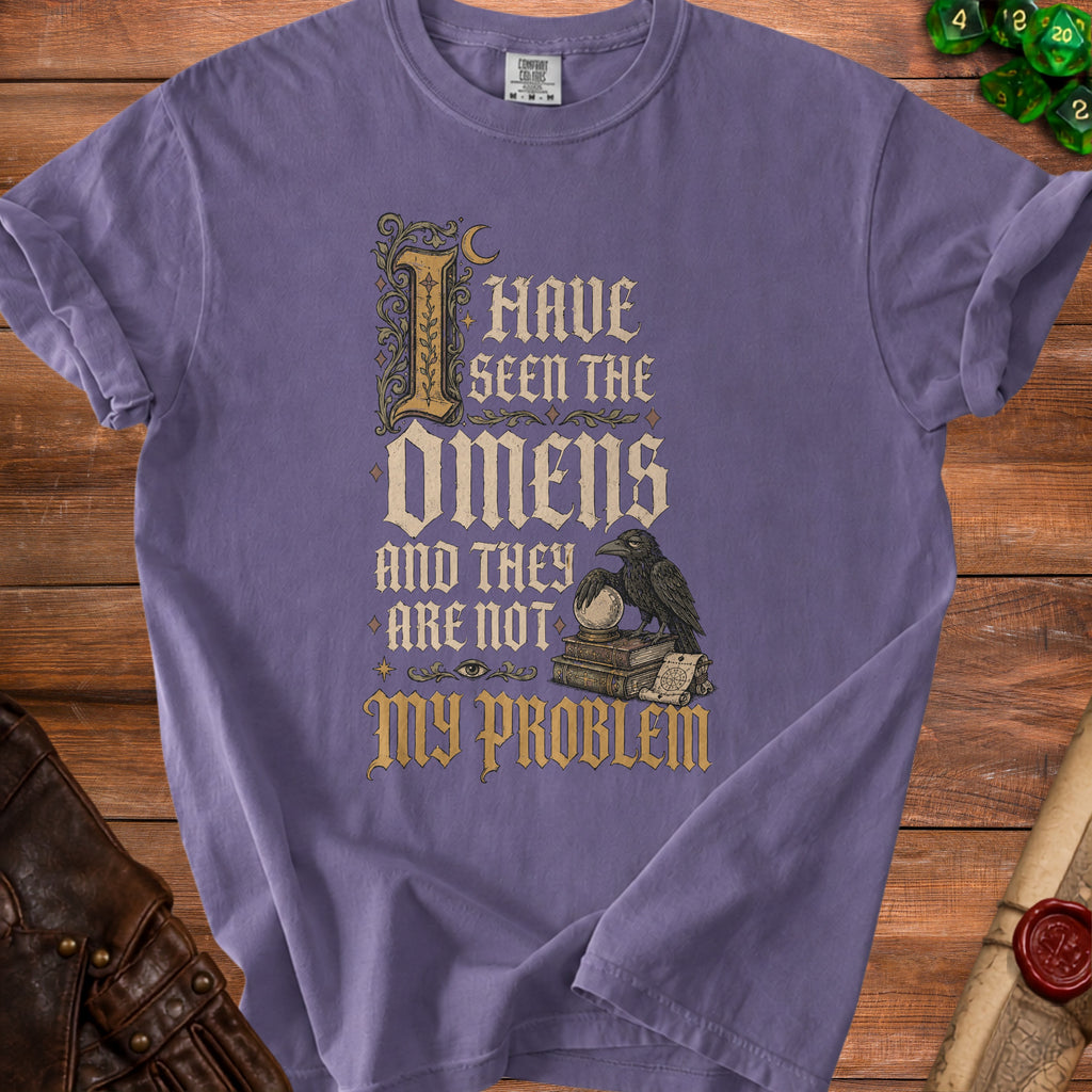 Purple t-shirt with gothic text "I HAVE SEEN THE OMENS AND THEY ARE NOT MY PROBLEM".