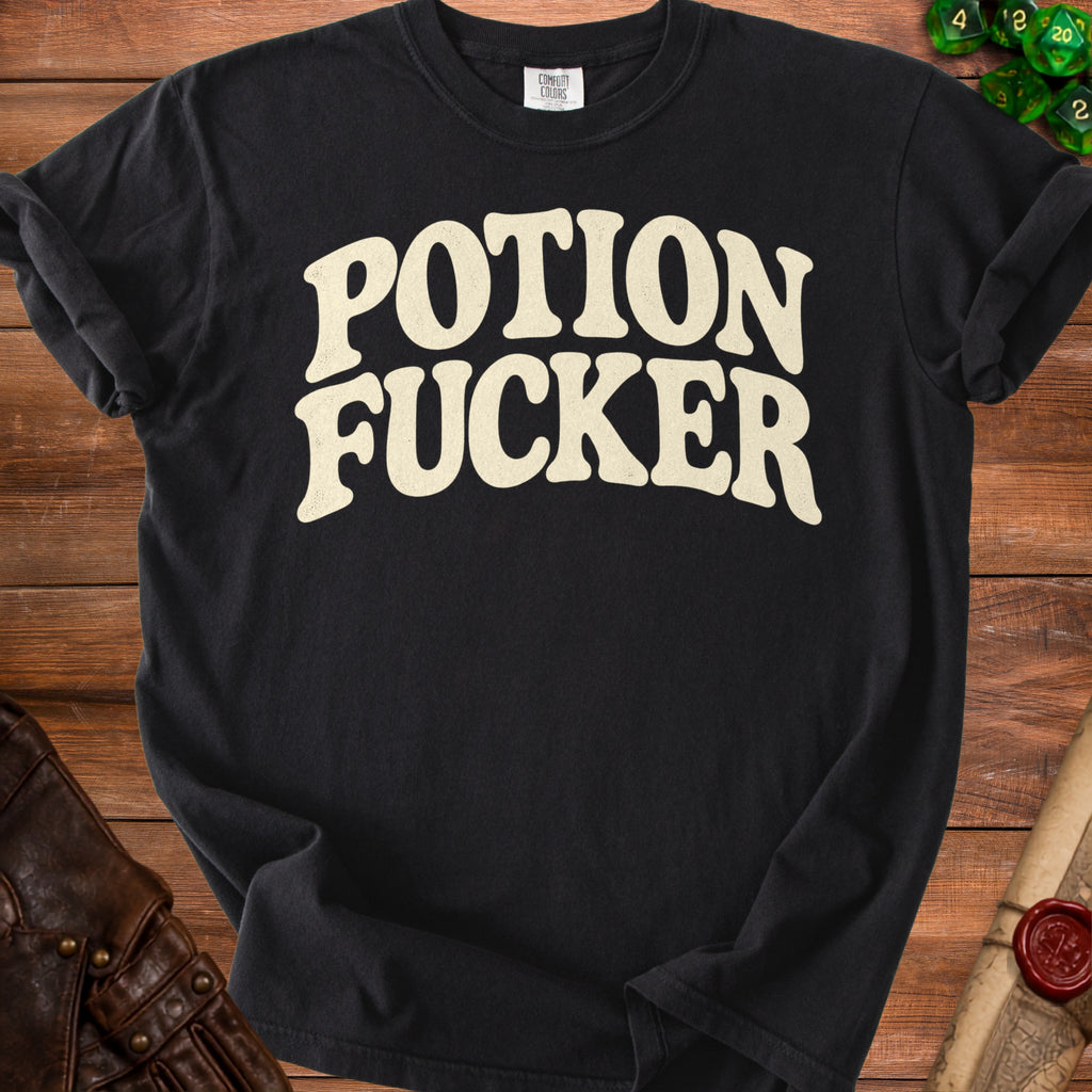 Black t-shirt with "POTION FUCKER" text in cream distressed lettering.