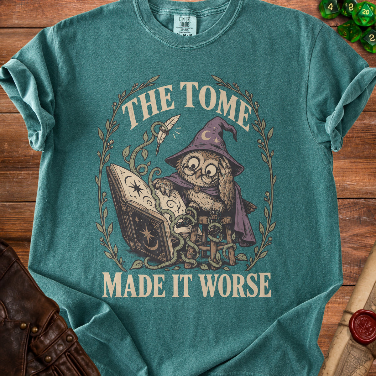 T-shirt with wizard owl reading a book and text "The Tome Made It Worse".