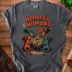 T-shirt graphic with four dragons playing a board game titled "Houses & Humans".