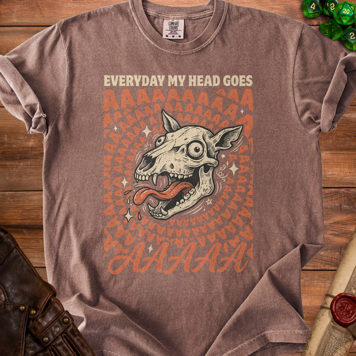 Brown t-shirt with "Everyday My Head Goes AAAAA" and screaming skull graphic.
