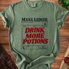 Green t-shirt with "Mana Ledger" and "Drink More Potions" in red text.