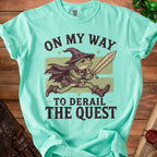 Frog wizard with sword runs on shirt with text "On My Way To Derail The Quest".