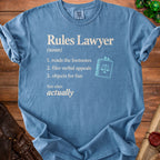 Blue t-shirt with "Rules Lawyer" definition and scales of justice icon.