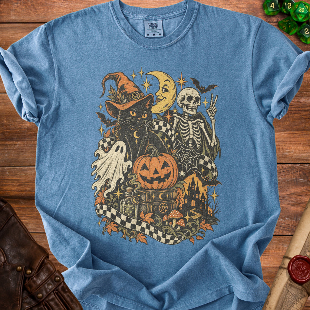 Blue t-shirt with a vintage Halloween graphic featuring a black cat, skeleton, and spooky elements.