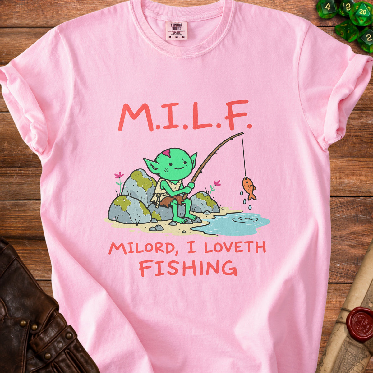 Pink t-shirt with M.I.L.F. text and goblin fishing illustration.