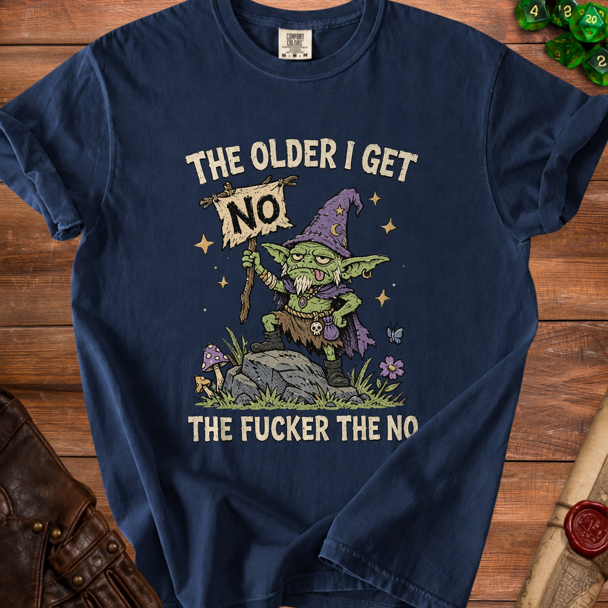 A grumpy goblin in a wizard hat holds a "NO" sign, with text "The older I get the fucker the no".