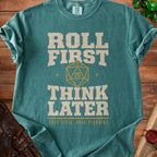 Teal t-shirt with "Roll First Think Later" text and a twenty-sided die.