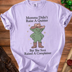 Lilac t-shirt with text "Momma Didn't Raise A Quitter But She Sure Raised A Complainer" and goblin graphic.