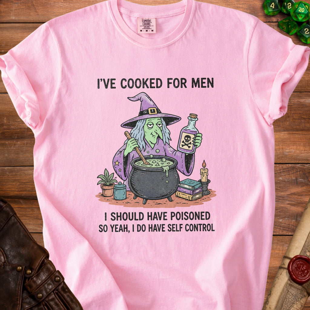 Pink t-shirt with a witch and cauldron graphic and text: "I'VE COOKED FOR MEN, I SHOULD HAVE POISONED SO YEAH, I DO HAVE SELF CONTROL".
