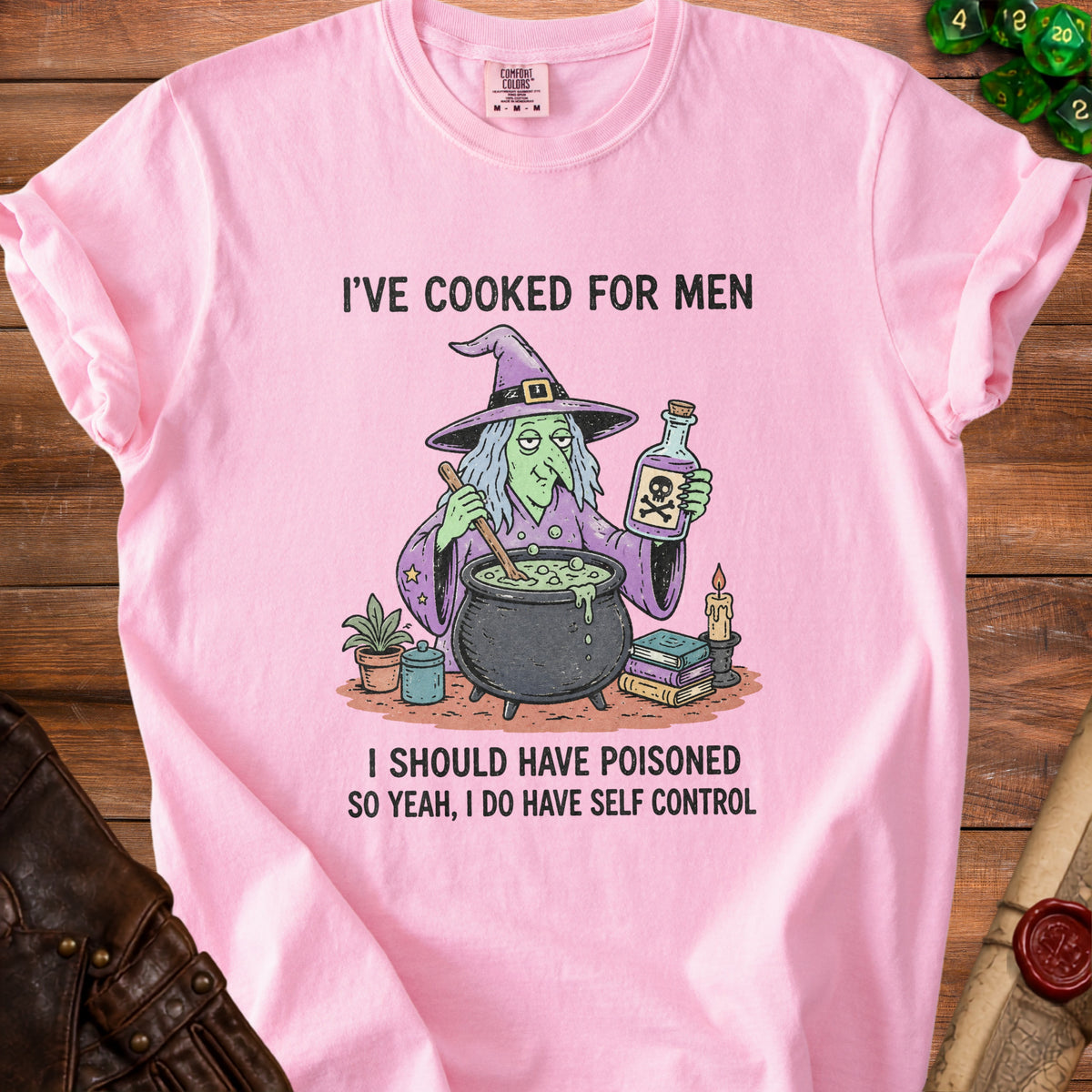Pink t-shirt with a witch and cauldron graphic and text: "I'VE COOKED FOR MEN, I SHOULD HAVE POISONED SO YEAH, I DO HAVE SELF CONTROL".