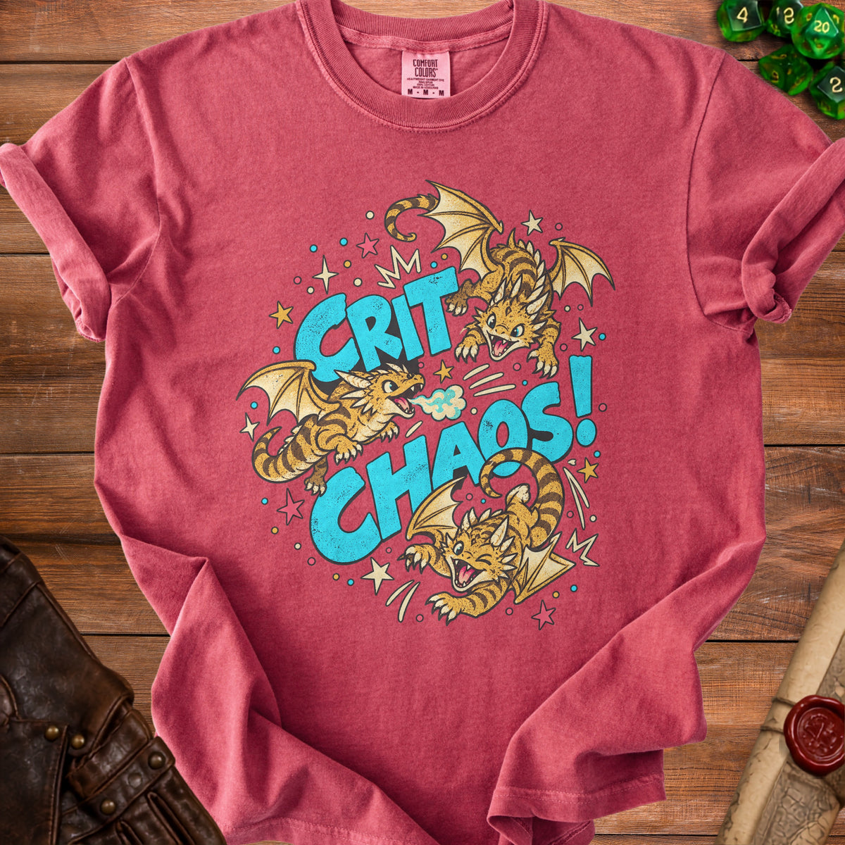 Red t-shirt with "Crit Chaos" and three cartoon dragons graphic.