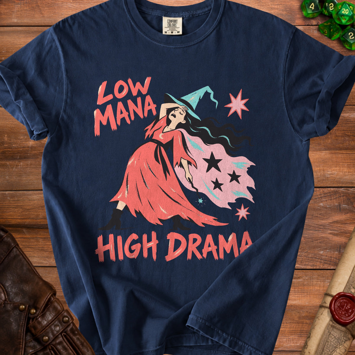 Navy t-shirt with distressed graphic of a witch and text "LOW MANA HIGH DRAMA".