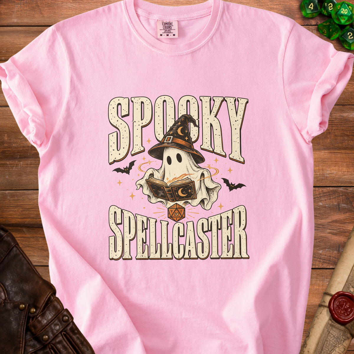 Pink t-shirt with "Spooky Spellcaster" text and a ghost graphic.