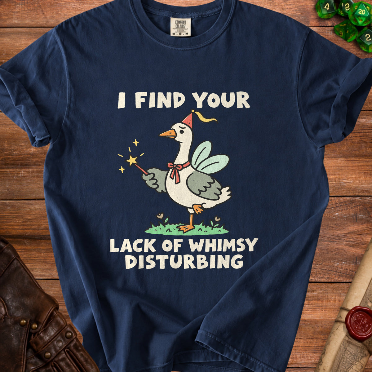 Navy t-shirt with goose in party hat holding a wand, text "I FIND YOUR LACK OF WHIMSY DISTURBING".