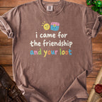 Brown t-shirt with "i came for the friendship and your loot" text and cartoon sun and chest.