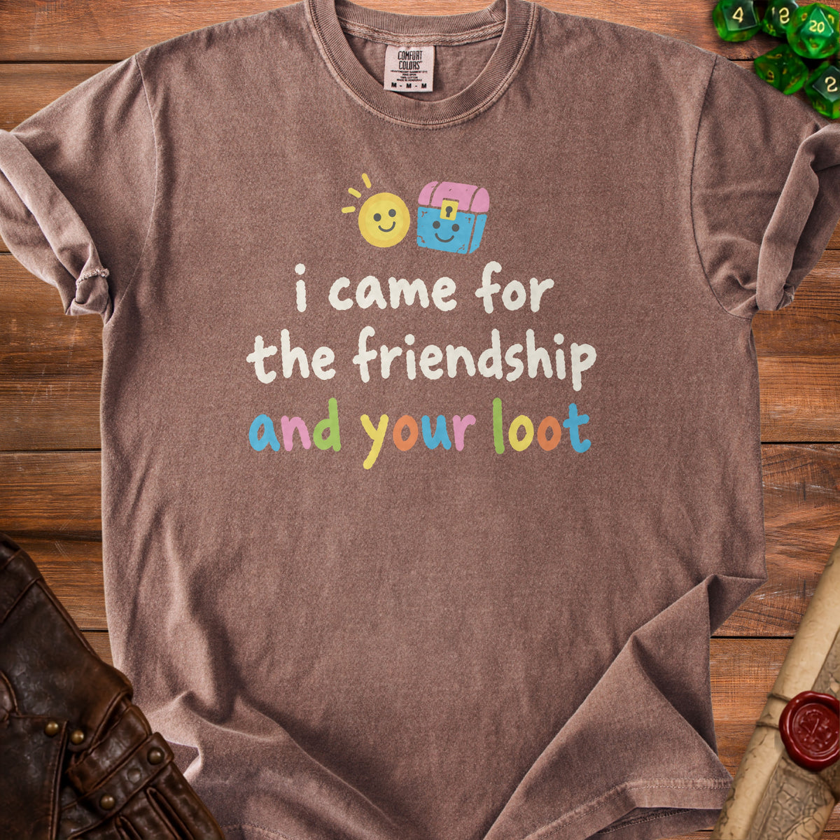 Brown t-shirt with "i came for the friendship and your loot" text and cartoon sun and chest.