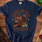 Devil sitting on a throne with skulls, flames, and text "IT'S HELL OUT THERE STAY INSIDE".