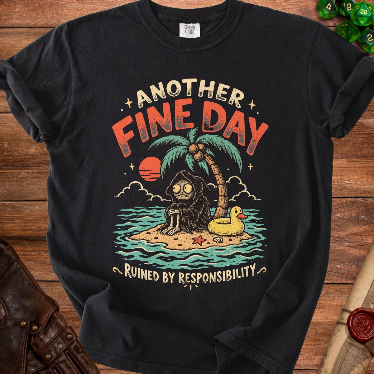 Black t-shirt with Grim Reaper on island saying "Another Fine Day Ruined By Responsibility".