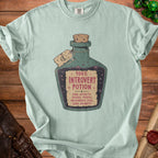 Light blue t-shirt with a "100% Introvert Potion" graphic and side effects list.