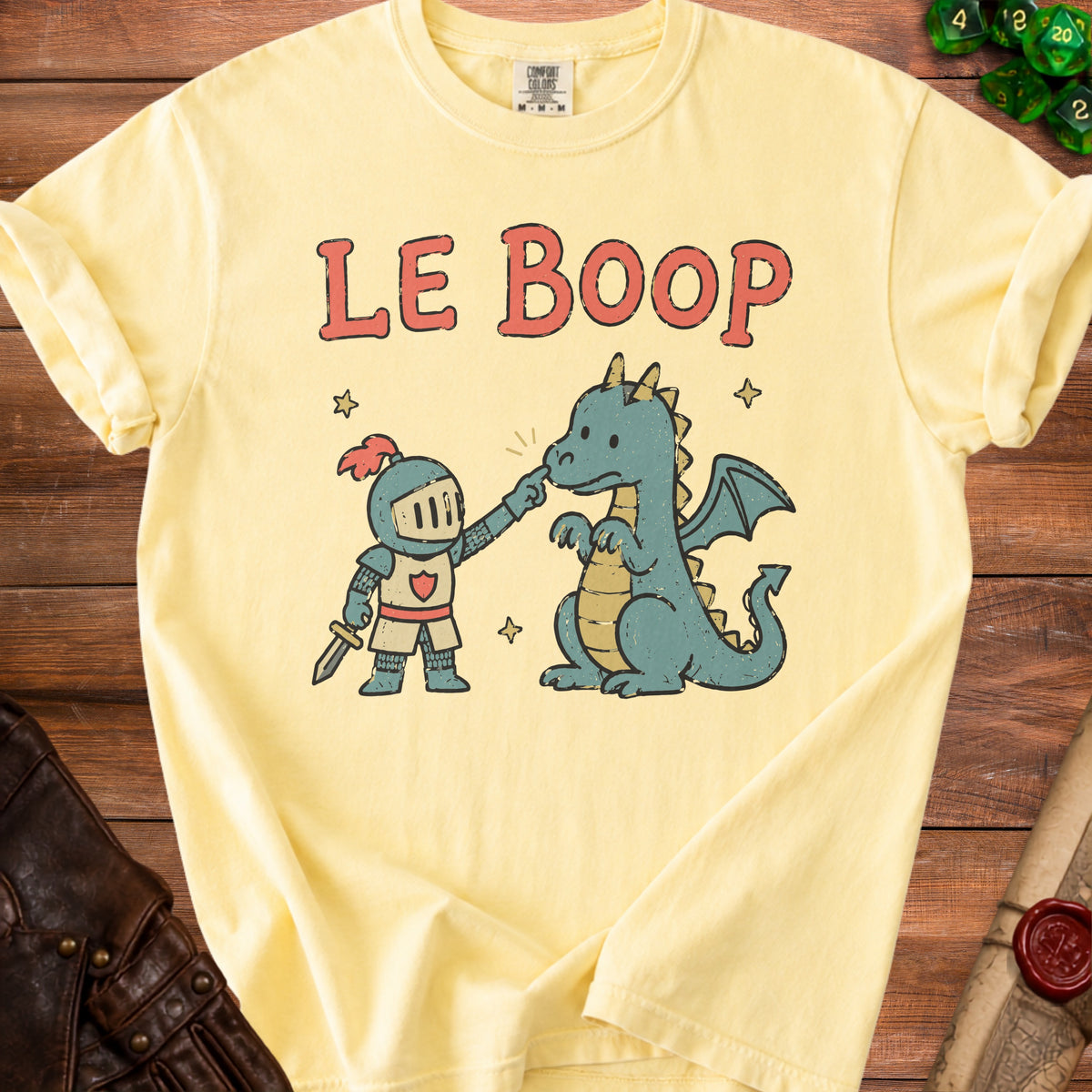 Yellow t-shirt with "LE BOOP" text and a knight poking a dragon.