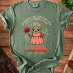 Green t-shirt with cartoon potato wearing crown and pink dress, saying "So I'm just shocked as you are."