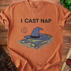 Orange t-shirt with "I CAST NAP" text and sleeping witch graphic.