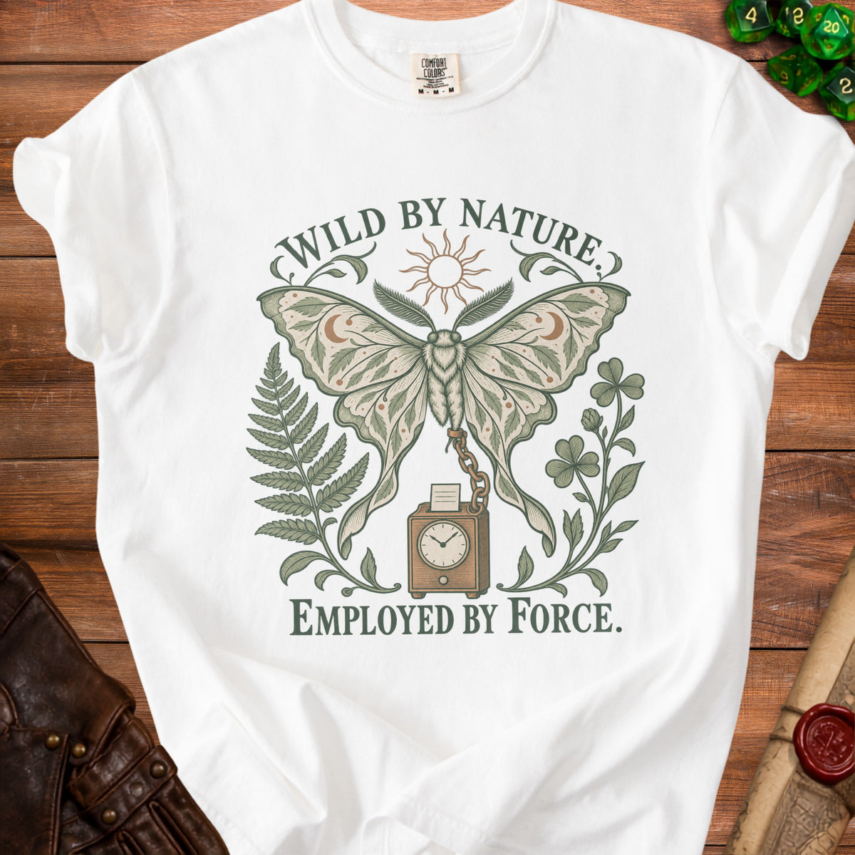 White t-shirt with a moth, sun, fern, clover, and clock design. "WILD BY NATURE. EMPLOYED BY FORCE."