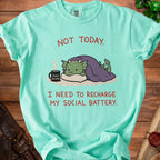 Mint t-shirt with green dragon graphic and text "NOT TODAY. I NEED TO RECHARGE MY SOCIAL BATTERY."