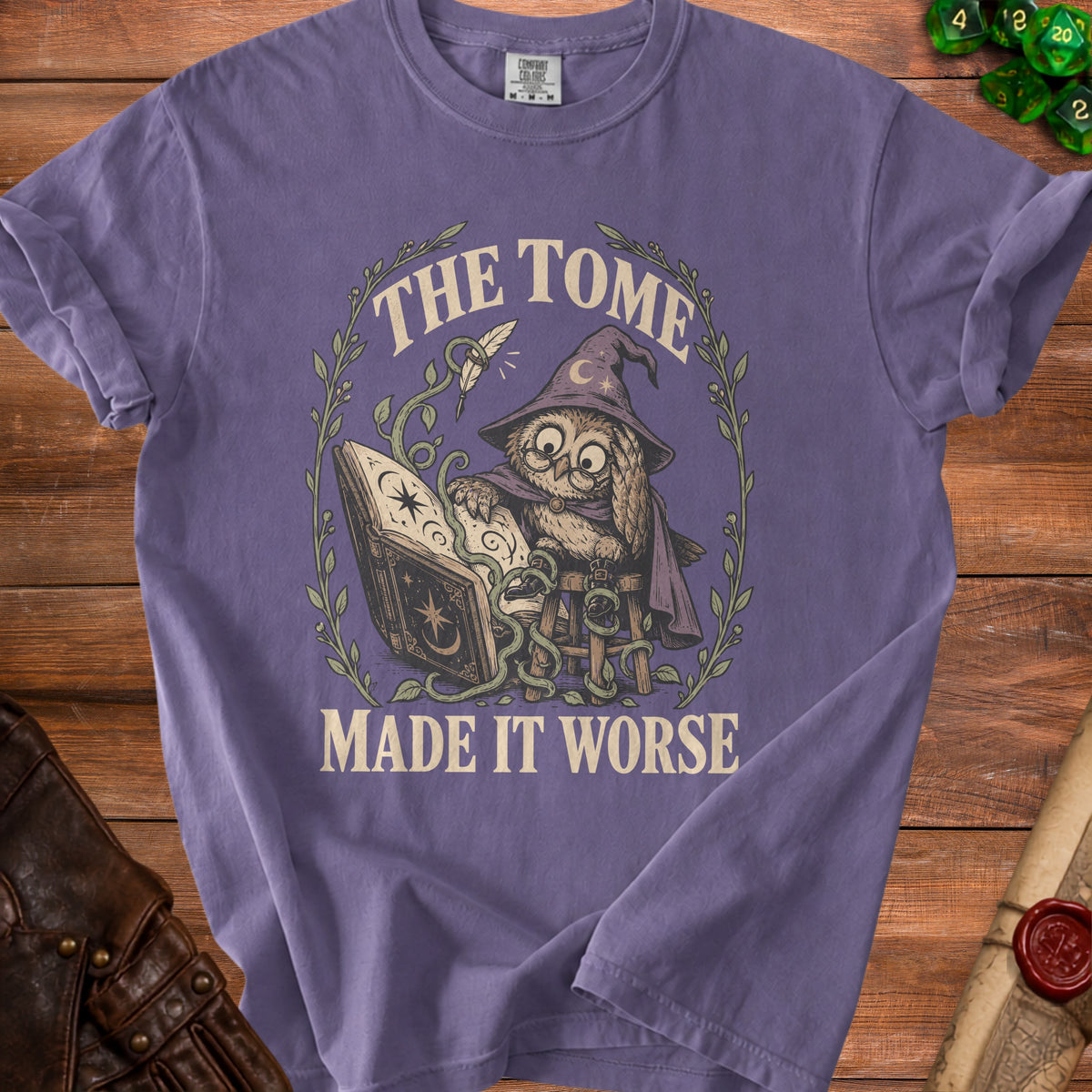 T-shirt graphic of owl wizard reading a book with text "THE TOME MADE IT WORSE".