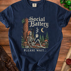 Skeleton in a forest holding coffee with "Social Battery 0%" and "Please Wait..." text.