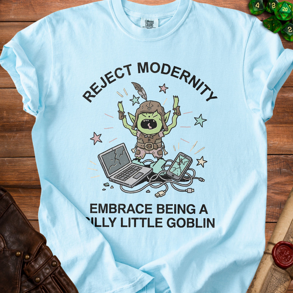 Light blue t-shirt with "Reject Modernity, Embrace Being a Silly Little Goblin" and goblin graphic.