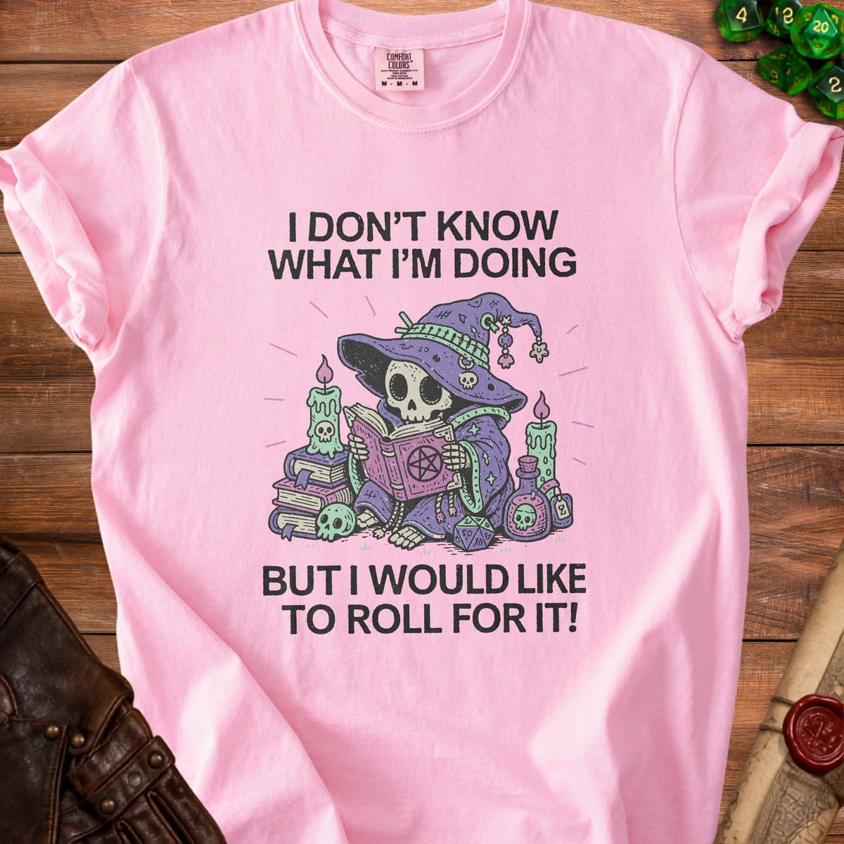 Pink t-shirt with skeleton wizard graphic and text "I Don't Know What I'm Doing But I Would Like To Roll For It!"