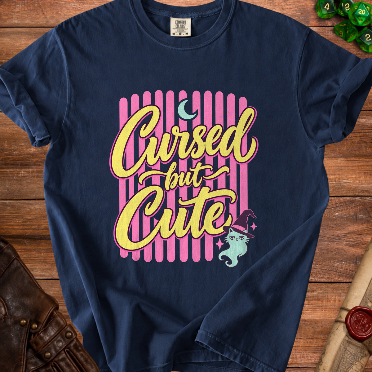 Navy t-shirt with "Cursed but Cute" text, moon, and ghost cat in witch hat.