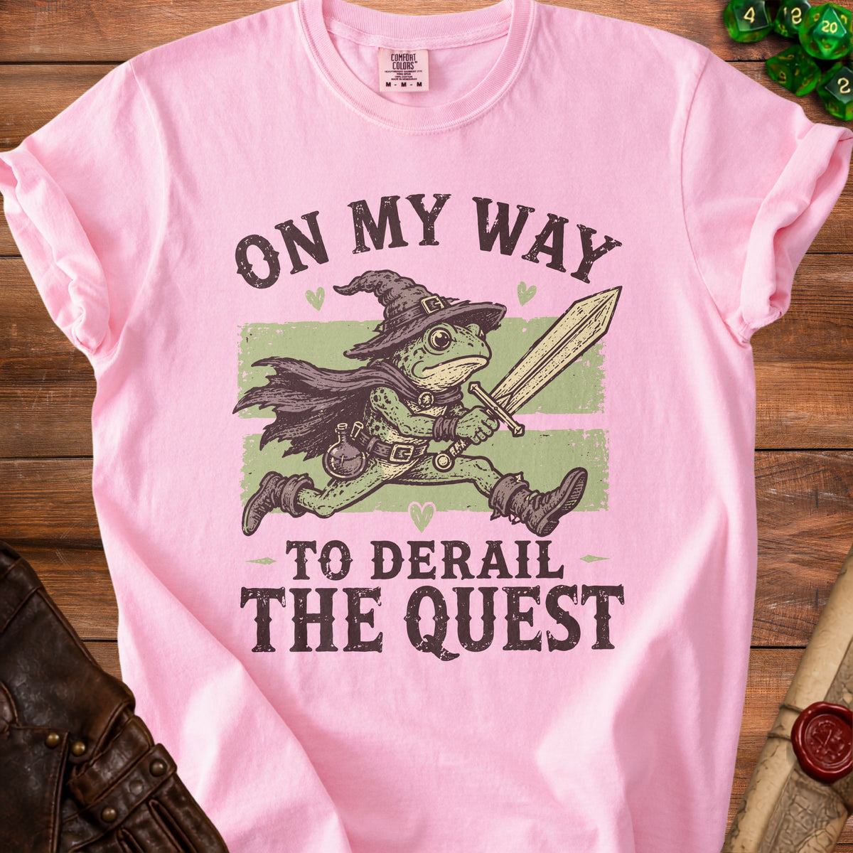Pink t-shirt with frog knight graphic and text "On My Way To Derail The Quest".
