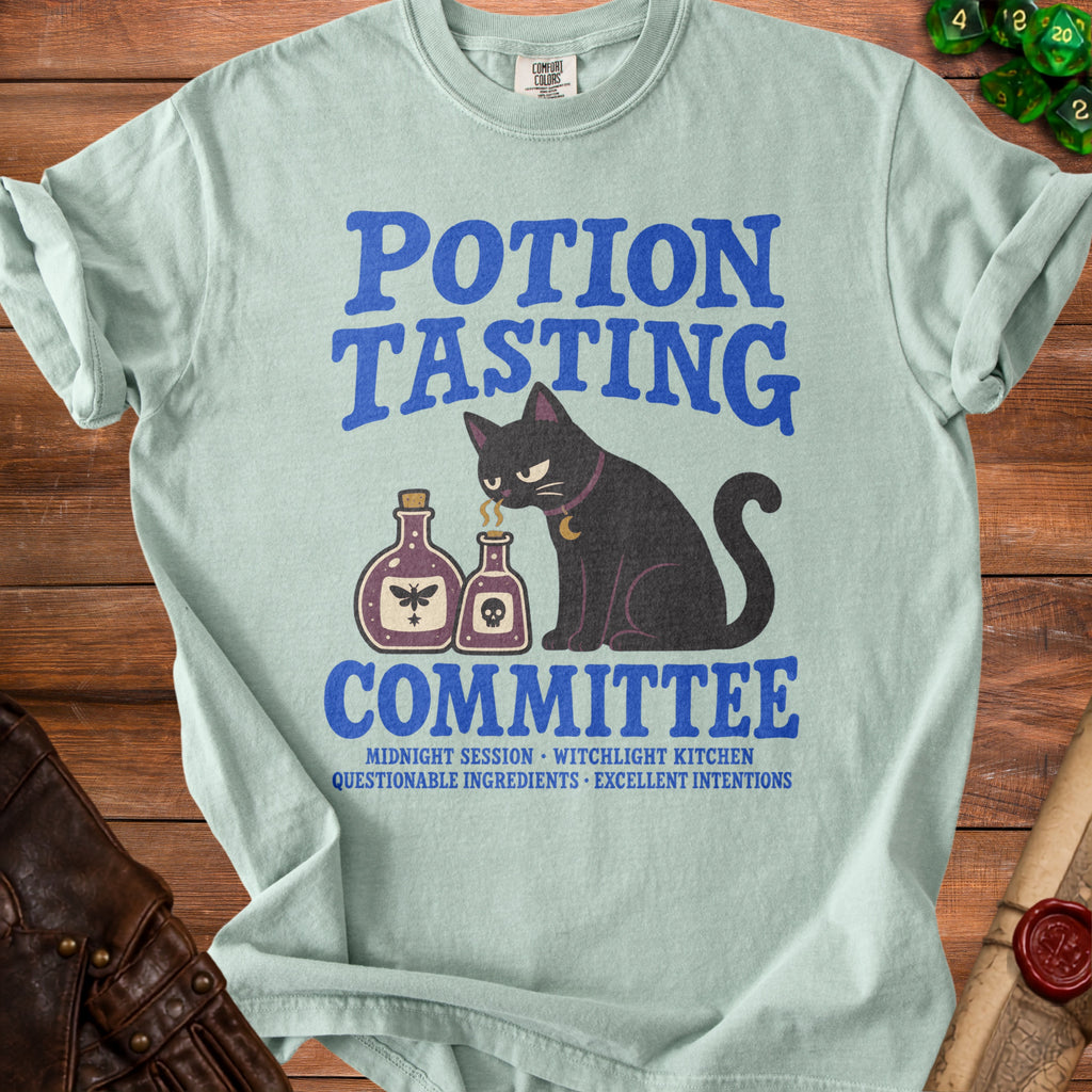 Light blue t-shirt with "Potion Tasting Committee" text, black cat, and potion bottles.