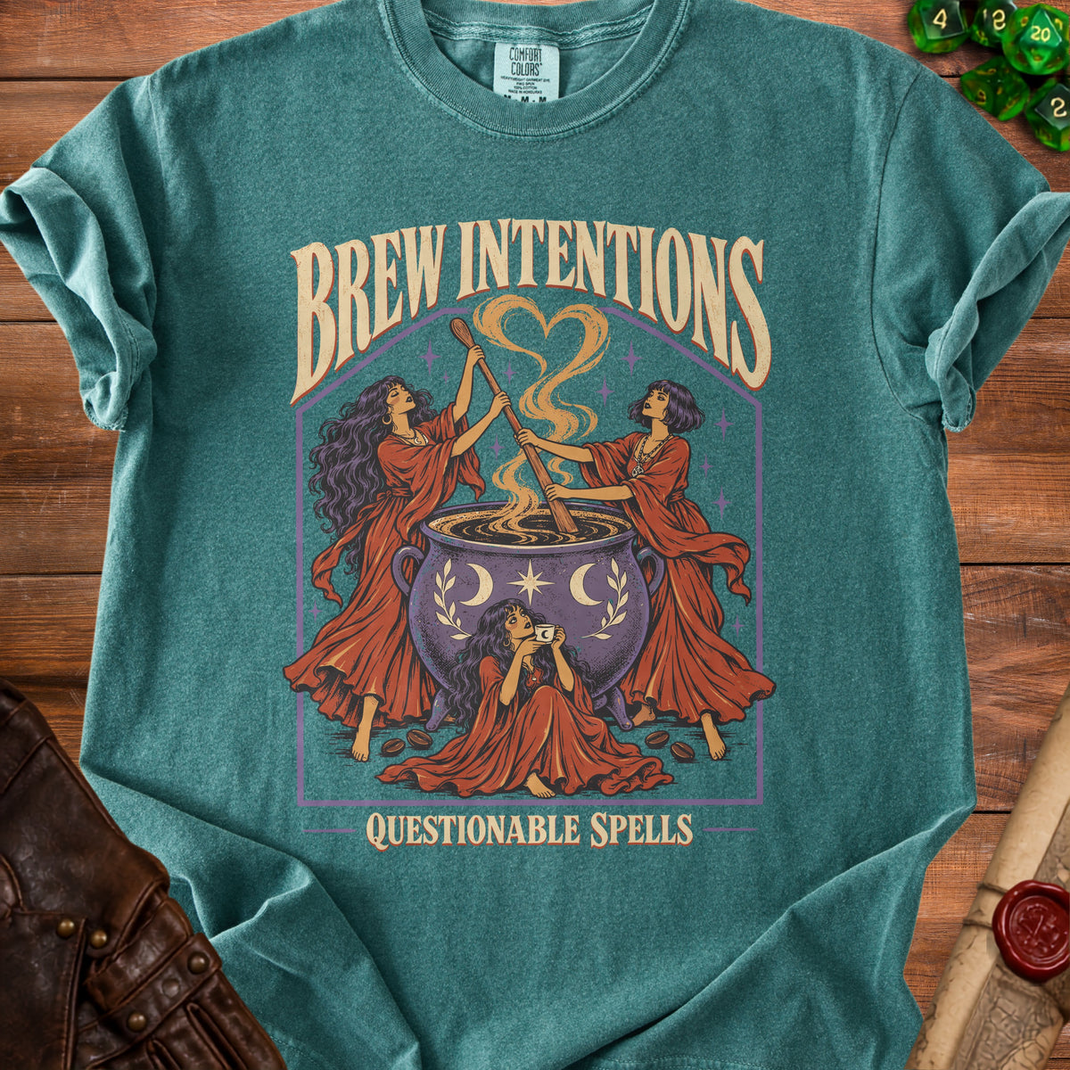 Green t-shirt with "Brew Intentions" and "Questionable Spells" featuring witches and a cauldron.