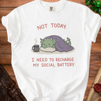 White t-shirt with a dragon graphic and text reading "Not Today. I Need to Recharge My Social Battery."