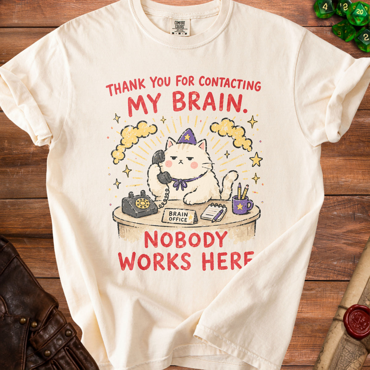 Cream t-shirt with a cat on the phone and text "Thank You For Contacting My Brain. Nobody Works Here."