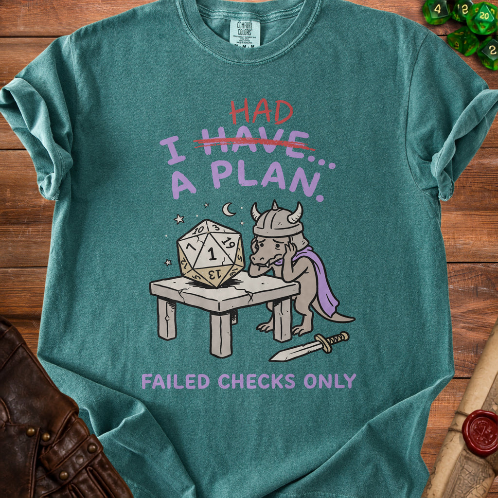 Green t-shirt with a dragon and dice graphic reading "I HAD A PLAN. Failed Checks Only."