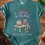 Green t-shirt with a dragon and dice graphic reading "I HAD A PLAN. Failed Checks Only."