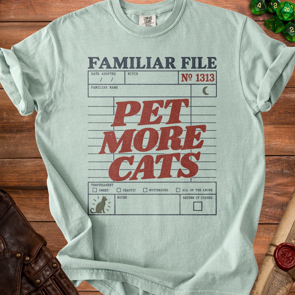 Light blue t-shirt with "Familiar File" and "Pet More Cats" graphic.