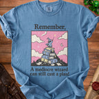Blue t-shirt with wizard on books graphic and text "Remember, A mediocre wizard can still cast a plan!"