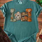 T-shirt graphic features a D20 die and a treasure chest with retro floral elements.