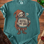 Grim reaper skeleton holding mug with "REFILL MY SOUL" text.