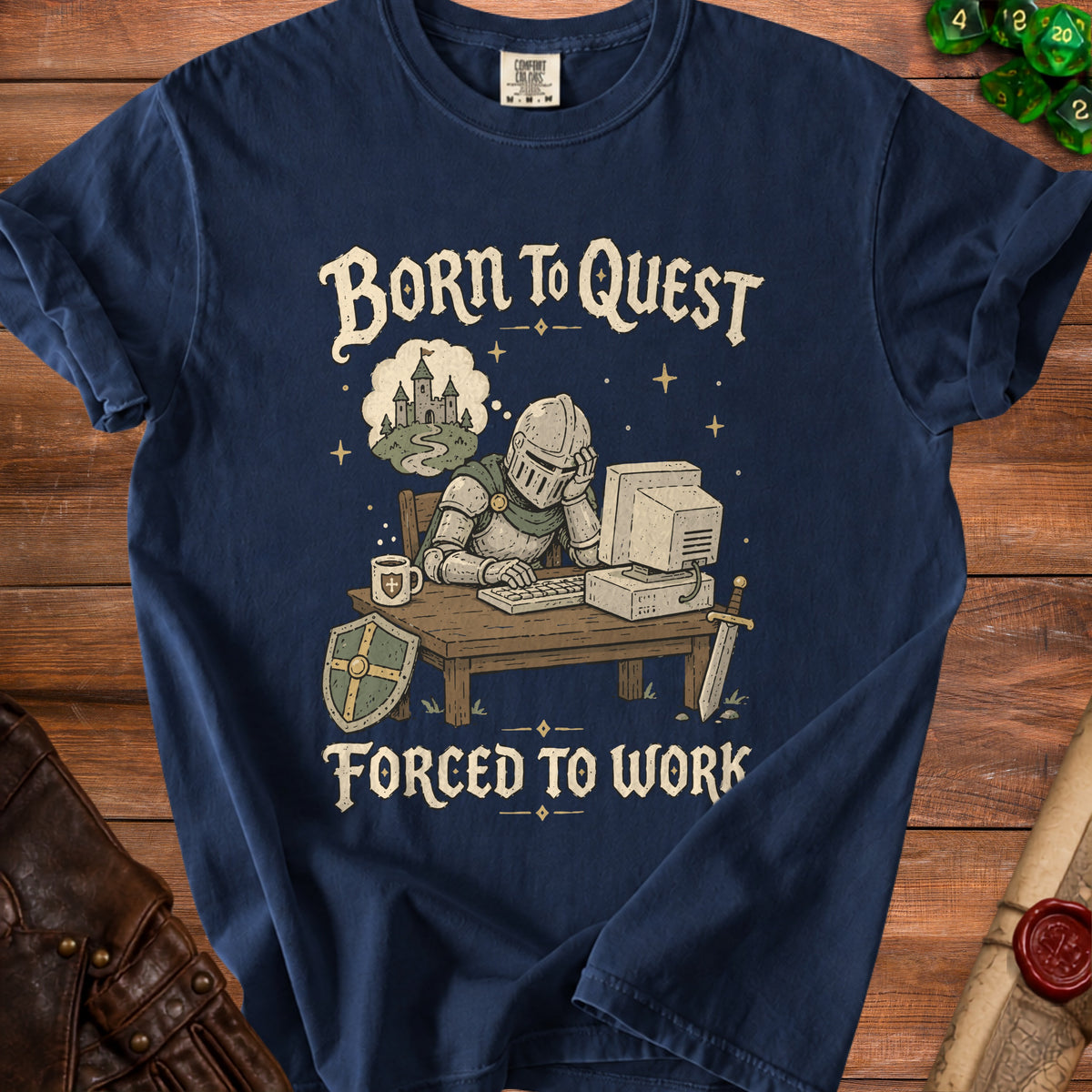Navy t-shirt graphic with knight at computer, text "Born to Quest Forced to Work."