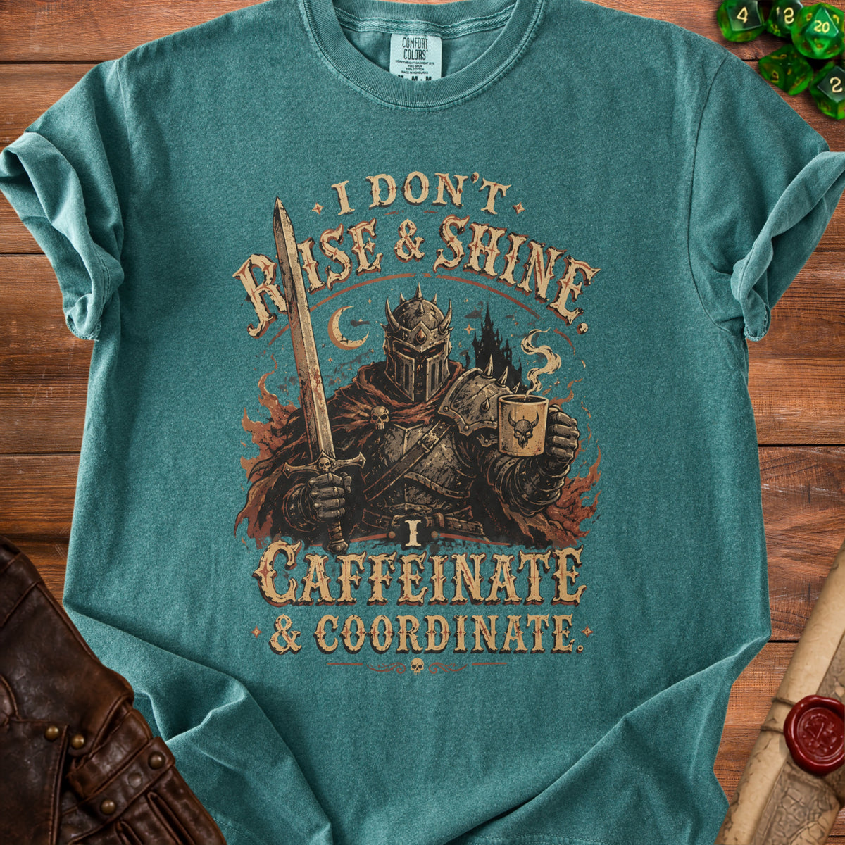 Teal t-shirt with knight holding sword and coffee, "I DON'T RISE & SHINE. CAFFEINATE & COORDINATE."
