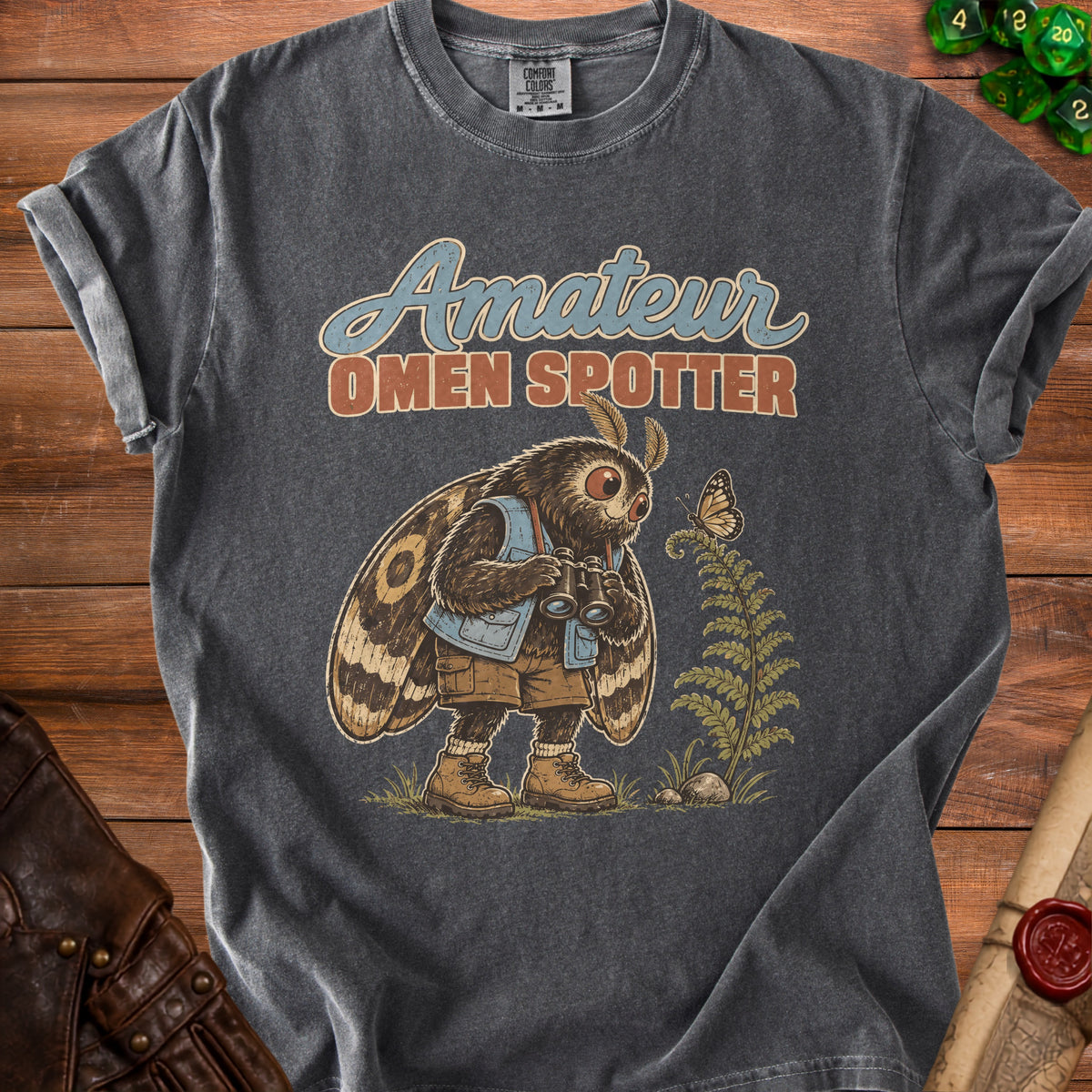 Moth character holding binoculars with text "Amateur Omen Spotter" on t-shirt.