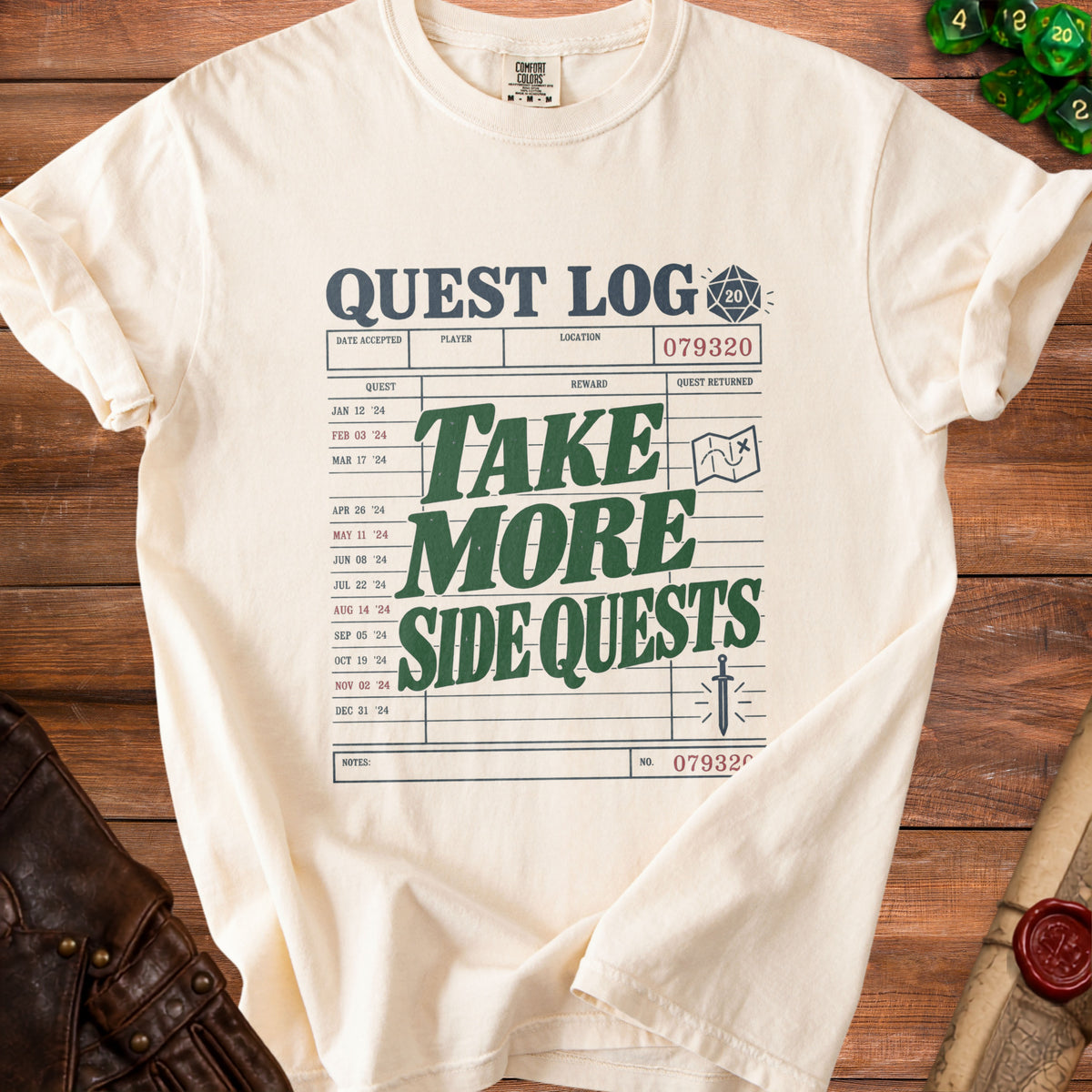 Cream t-shirt with "Quest Log Take More Side Quests" graphic.