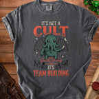 Dark grey t-shirt with Cthulhu graphic and text "It's not a cult, it's team building".